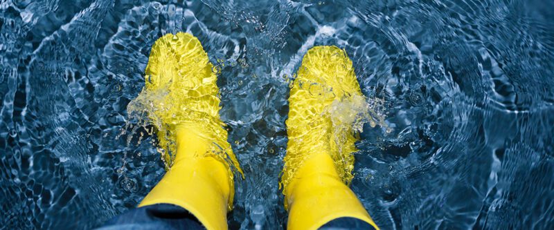 Flood insurance - image of yellow boots in water